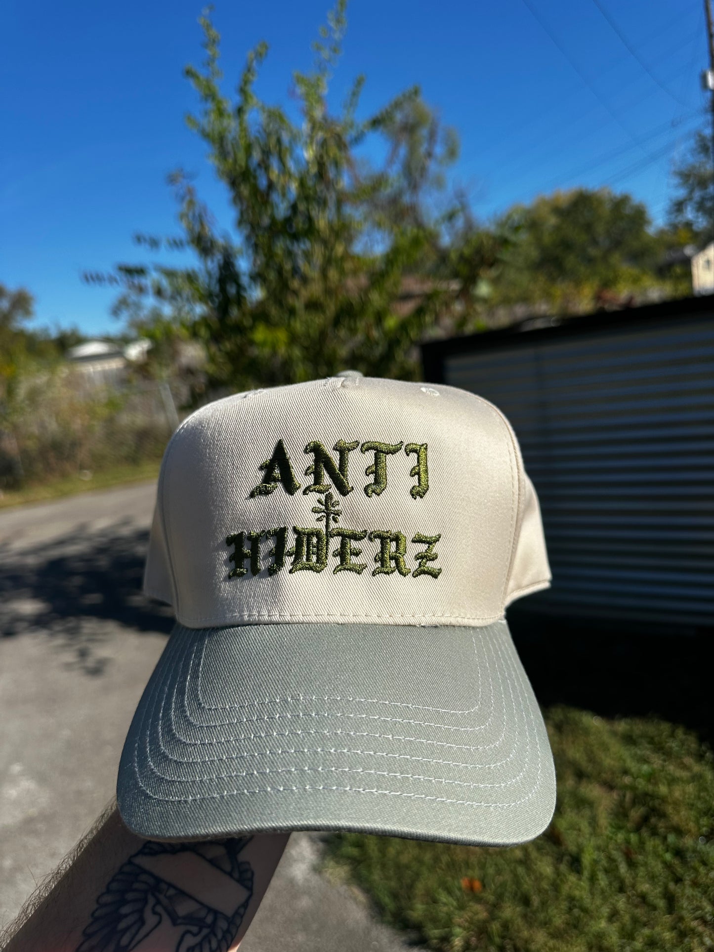 Anti/Hiderz "Tan with Sage Green Font” Hat